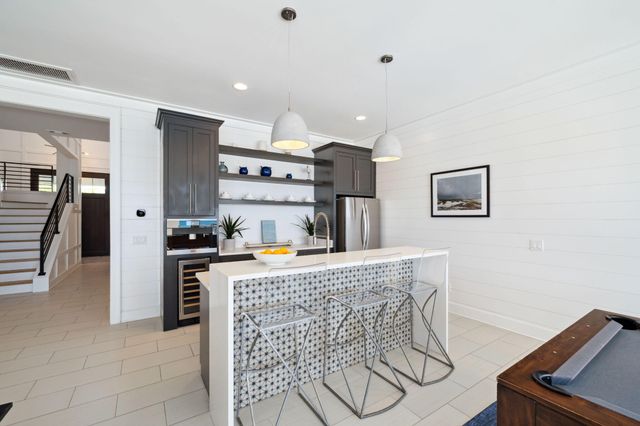 a bedroom with a large bed and a night stand