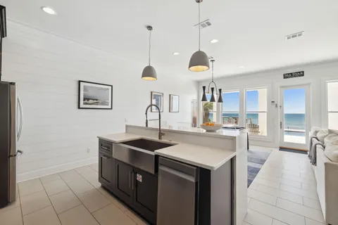 a view of a workspace with furniture and a flat screen tv