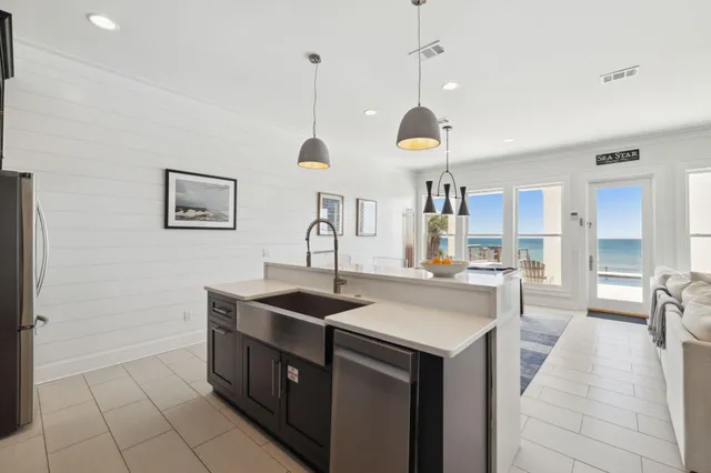 a view of a workspace with furniture and a flat screen tv