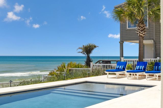 a kitchen with stainless steel appliances granite countertop a sink dishwasher stove and cabinets