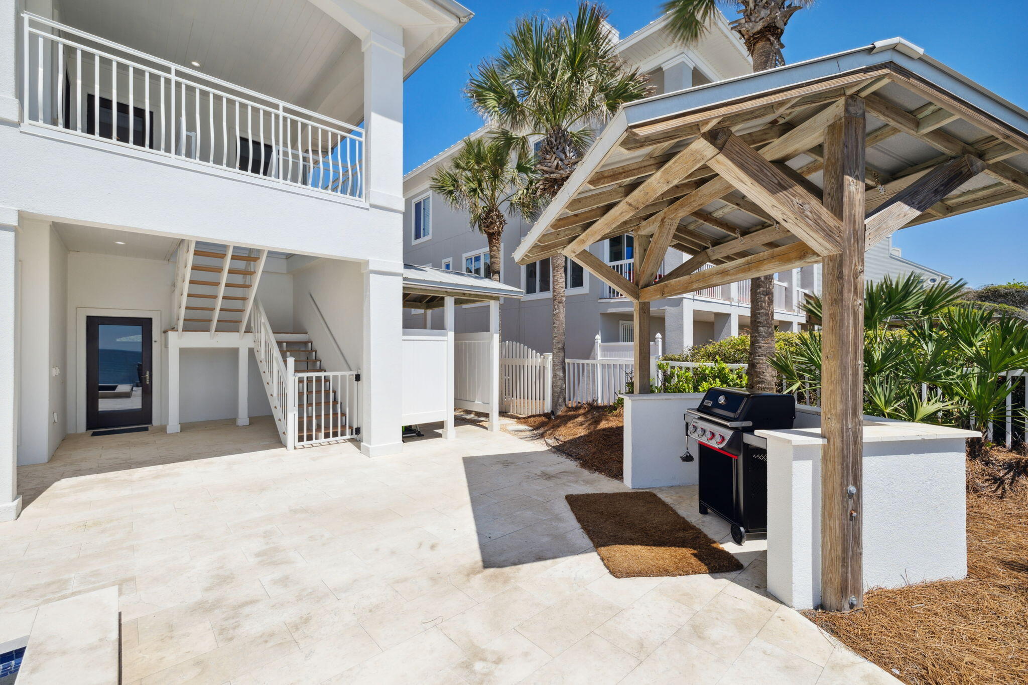 8266 East County Highway 30A Seacrest, FL 32461 - Photo 32 of 148 a view of a house with backyard and sitting area