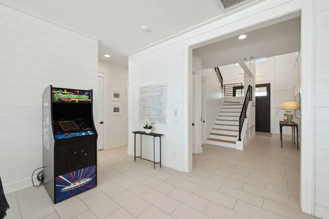 a view of a living room and entryway in a room