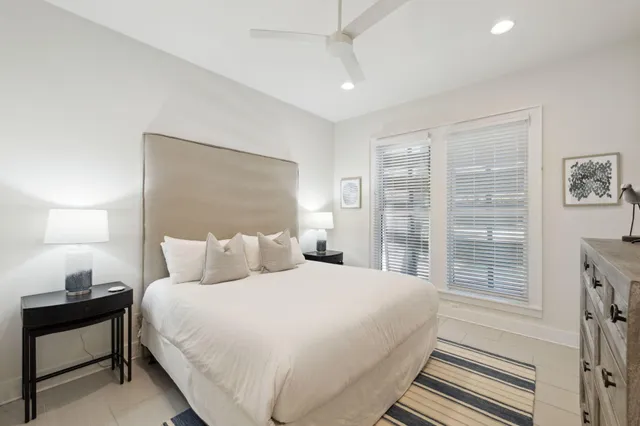 a bathroom with a double vanity sink toilet and shower