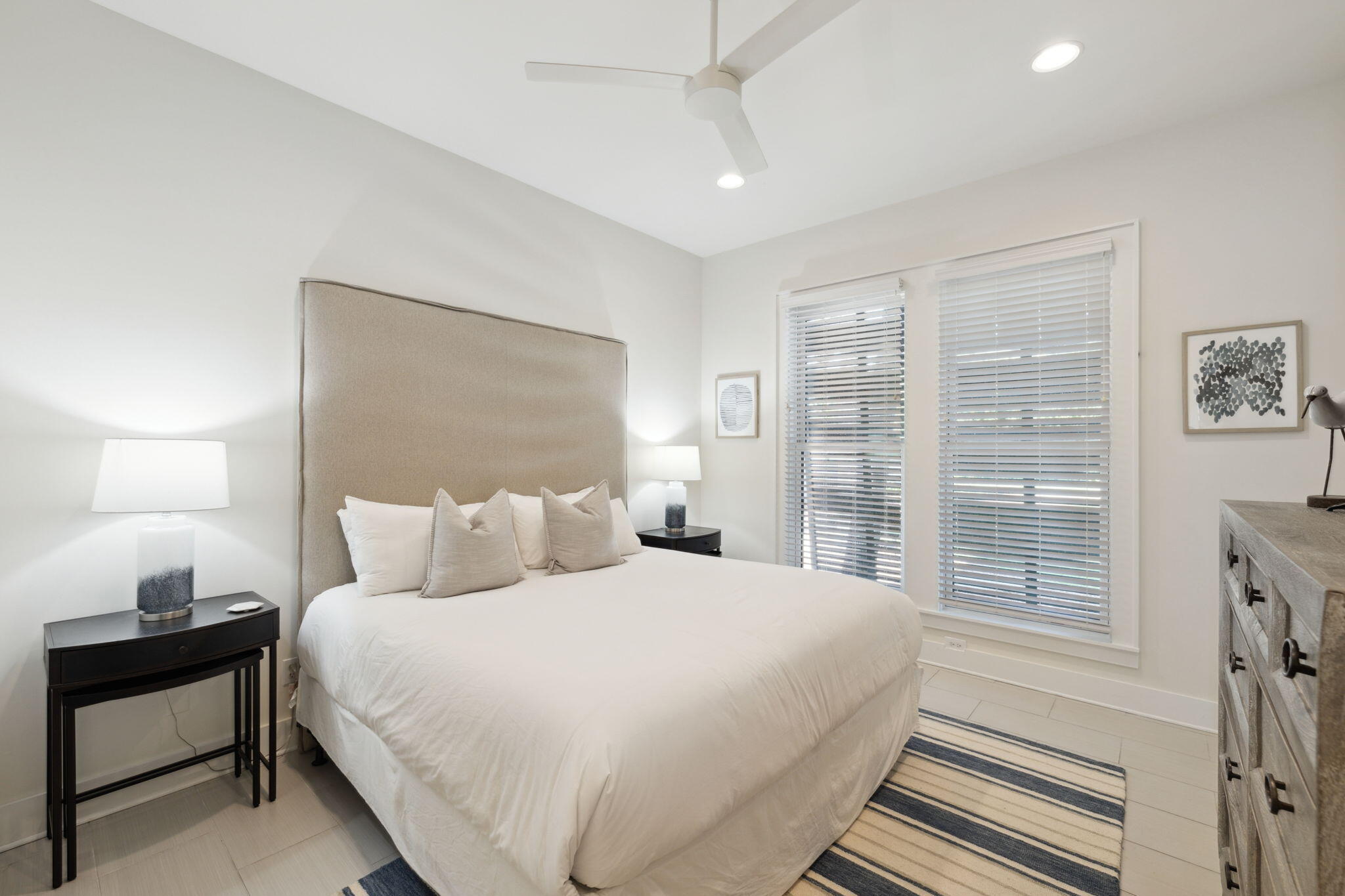 8266 East County Highway 30A Seacrest, FL 32461 - Photo 43 of 148 a bedroom with a large bed and a night stand