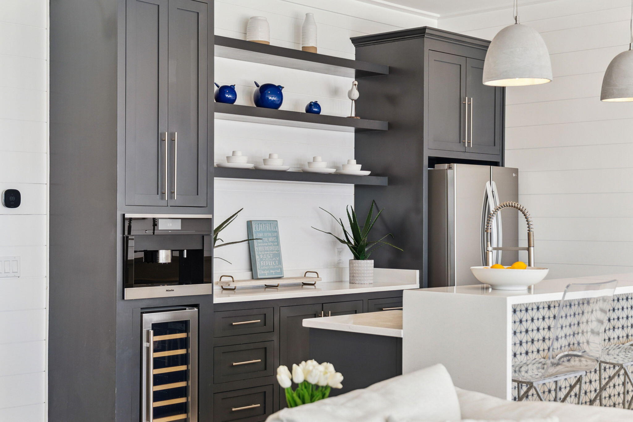 8266 East County Highway 30A Seacrest, FL 32461 - Photo 47 of 148 a kitchen with stainless steel appliances granite countertop a refrigerator and a sink