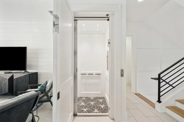 a front view of a house with yard fire pit and outdoor seating