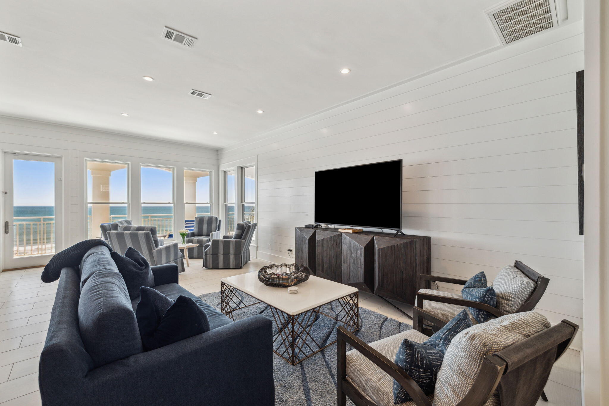 8266 East County Highway 30A Seacrest, FL 32461 - Photo 51 of 148 a living room with furniture and a flat screen tv