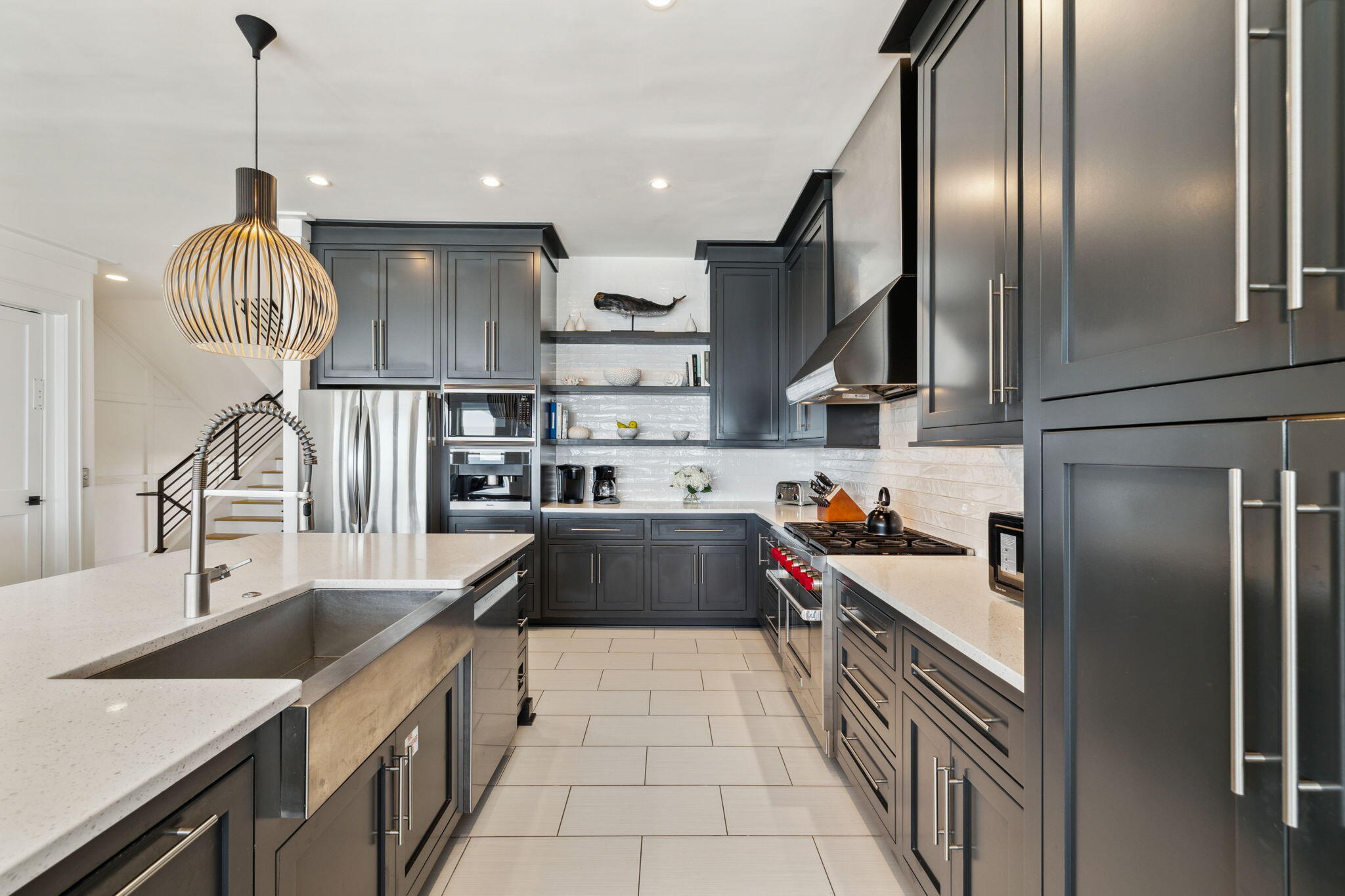 8266 East County Highway 30A Seacrest, FL 32461 - Photo 56 of 148 a kitchen with stainless steel appliances granite countertop a sink a stove and a wooden floors