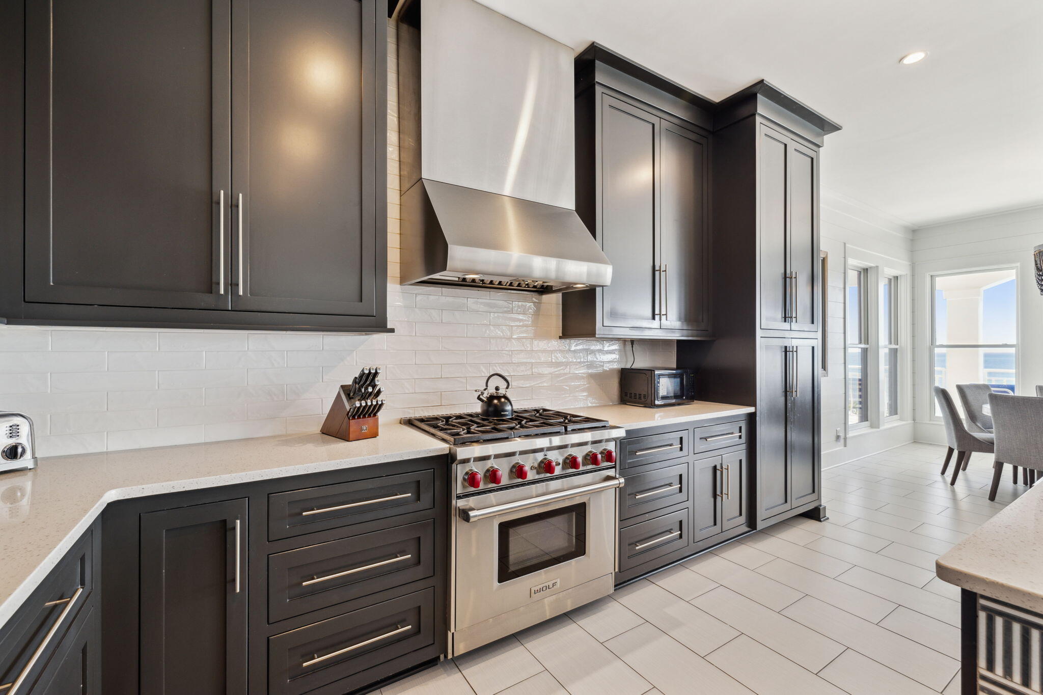 8266 East County Highway 30A Seacrest, FL 32461 - Photo 57 of 148 a kitchen with stainless steel appliances a stove a sink and a refrigerator
