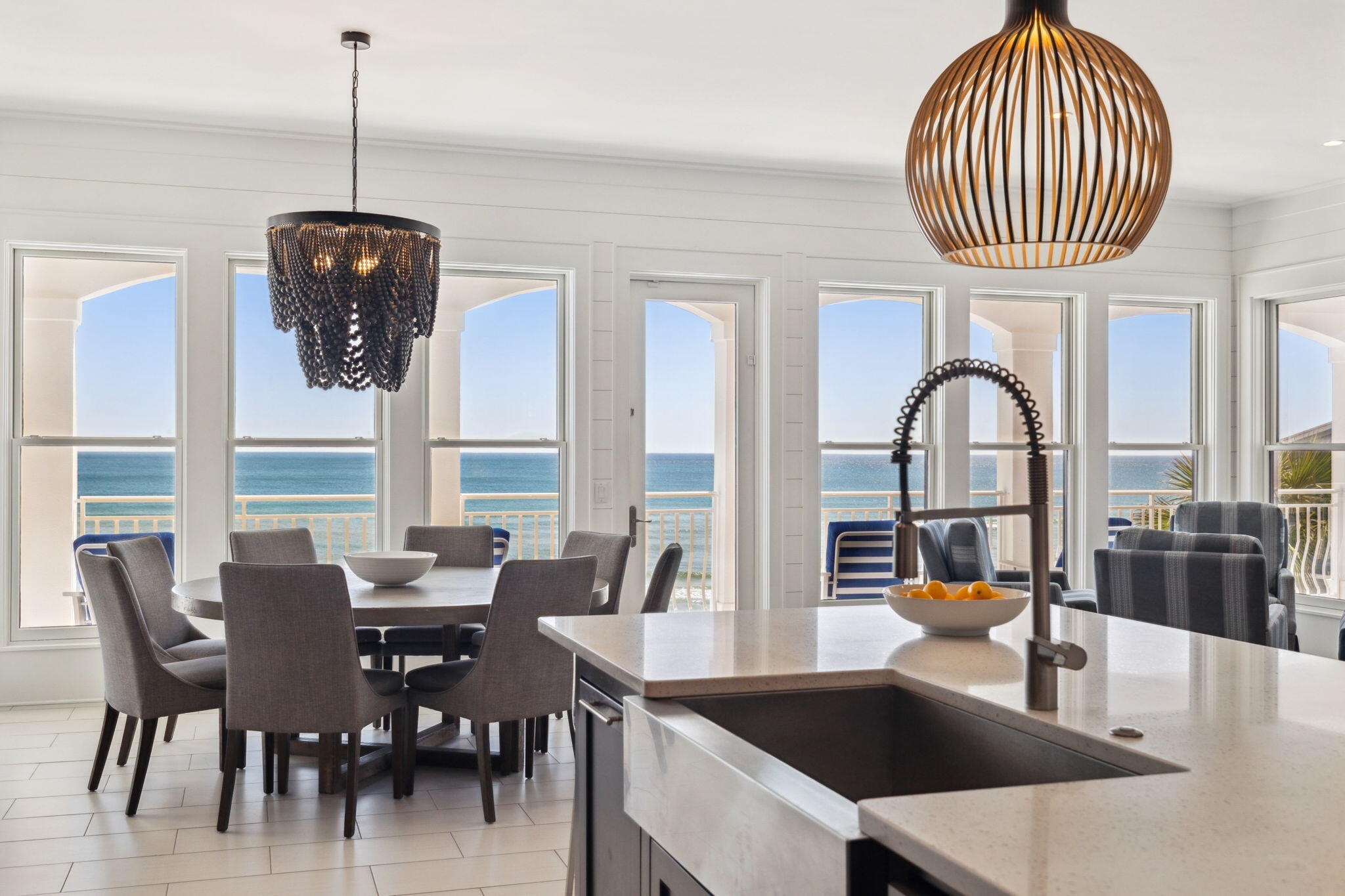 8266 East County Highway 30A Seacrest, FL 32461 - Photo 67 of 148 a dining room with furniture a chandelier and a rug