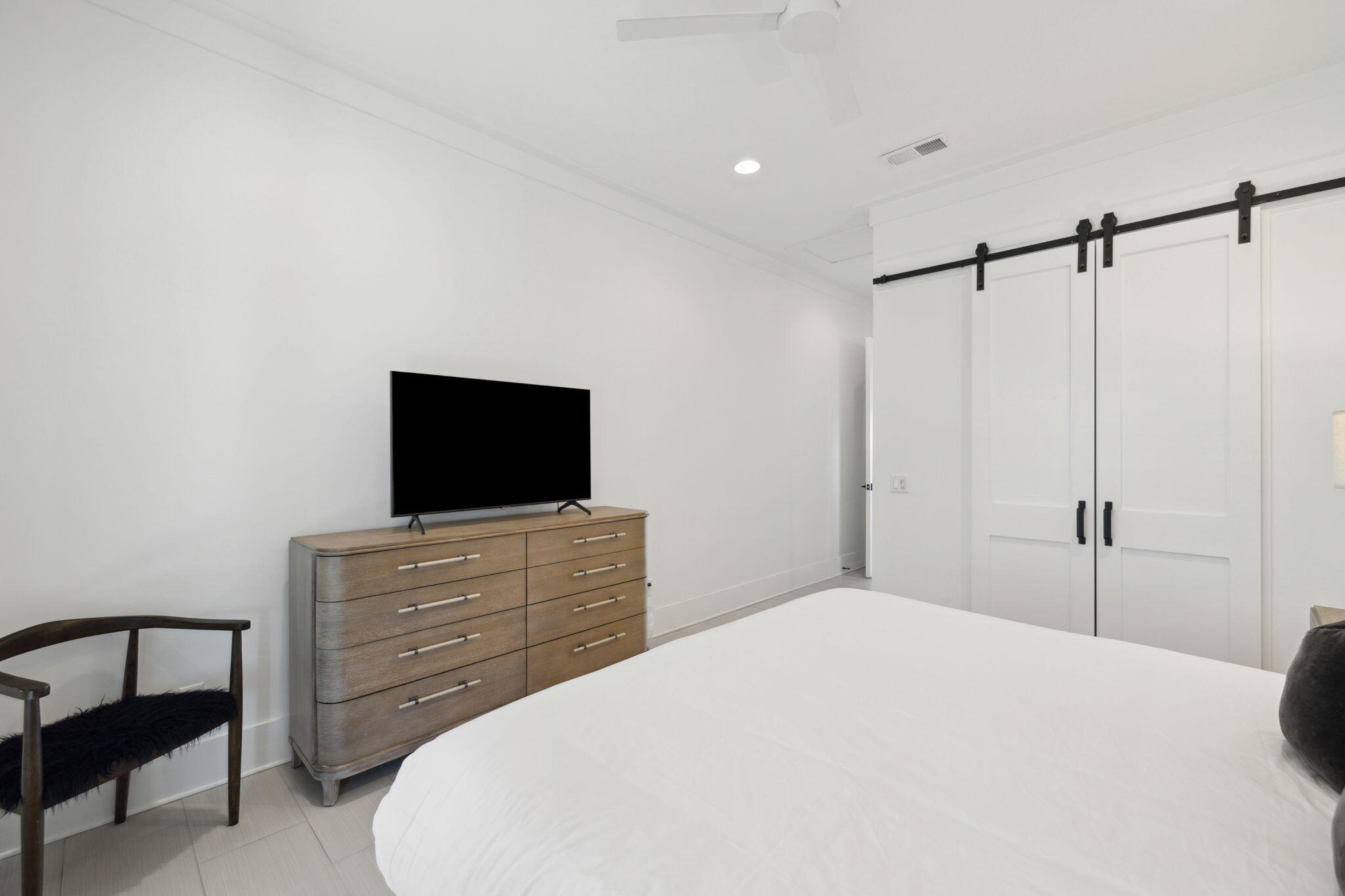 8266 East County Highway 30A Seacrest, FL 32461 - Photo 82 of 148 a bedroom with a bed and a flat screen tv