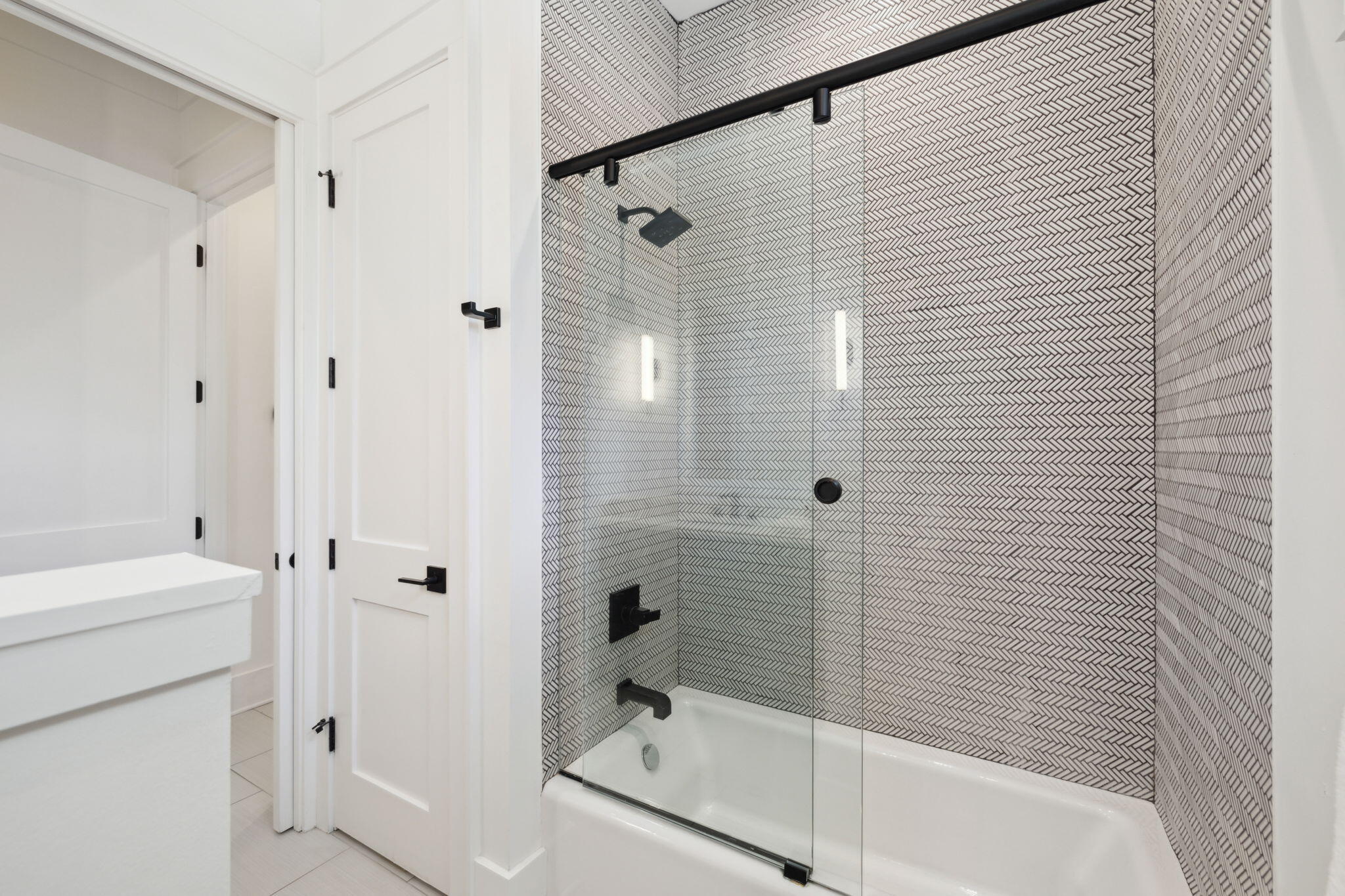 8266 East County Highway 30A Seacrest, FL 32461 - Photo 84 of 148 a bathroom with a shower and a tub