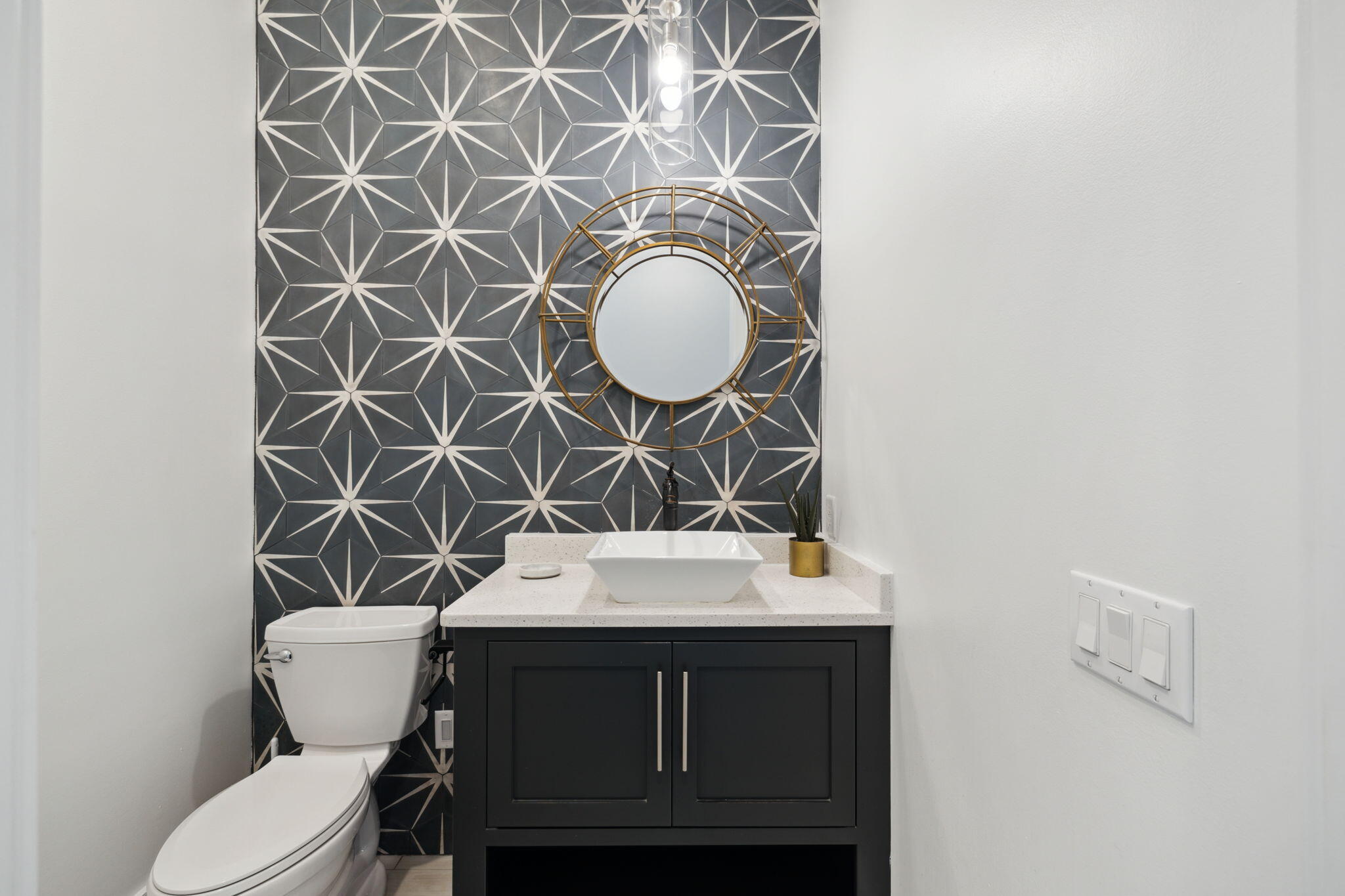 8266 East County Highway 30A Seacrest, FL 32461 - Photo 90 of 148 a bathroom with a sink mirror vanity and toilet