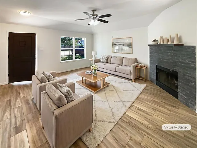 a living room with furniture and a fireplace
