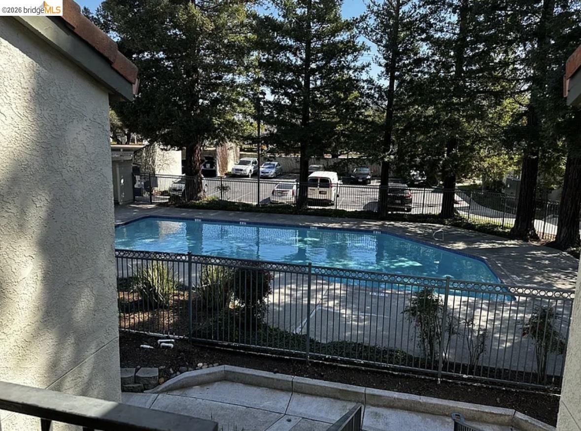 1505 Kirker Pass Road, Unit 214 Concord, CA 94521 - Photo 47 of 55 Rectangular swimming pool with a black wrought iron fence