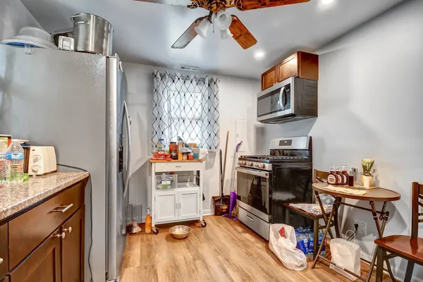 a view of a kitchen with workspace and a window