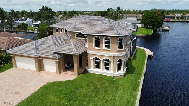 a aerial view of a house with table and chairs