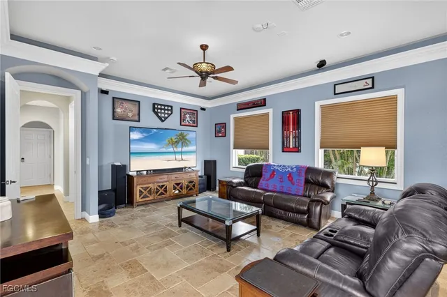 a living room with furniture kitchen view and a large window
