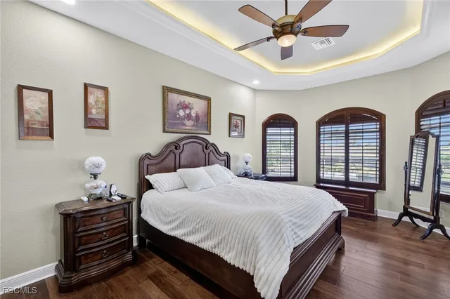 a bedroom with two beds and a large mirror