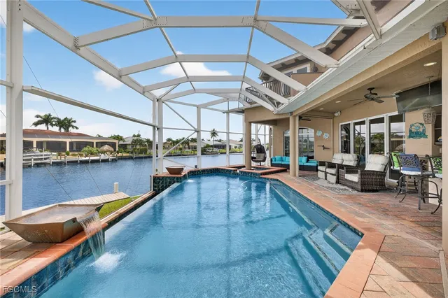 a view of a swimming pool and lounge chair