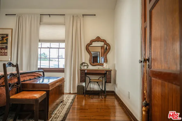 a bedroom with bed and window