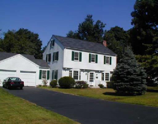 38 Applegate Road Fairfield, CT 06825 - Photo 1 of 1 a front view of a house with a garden and yard