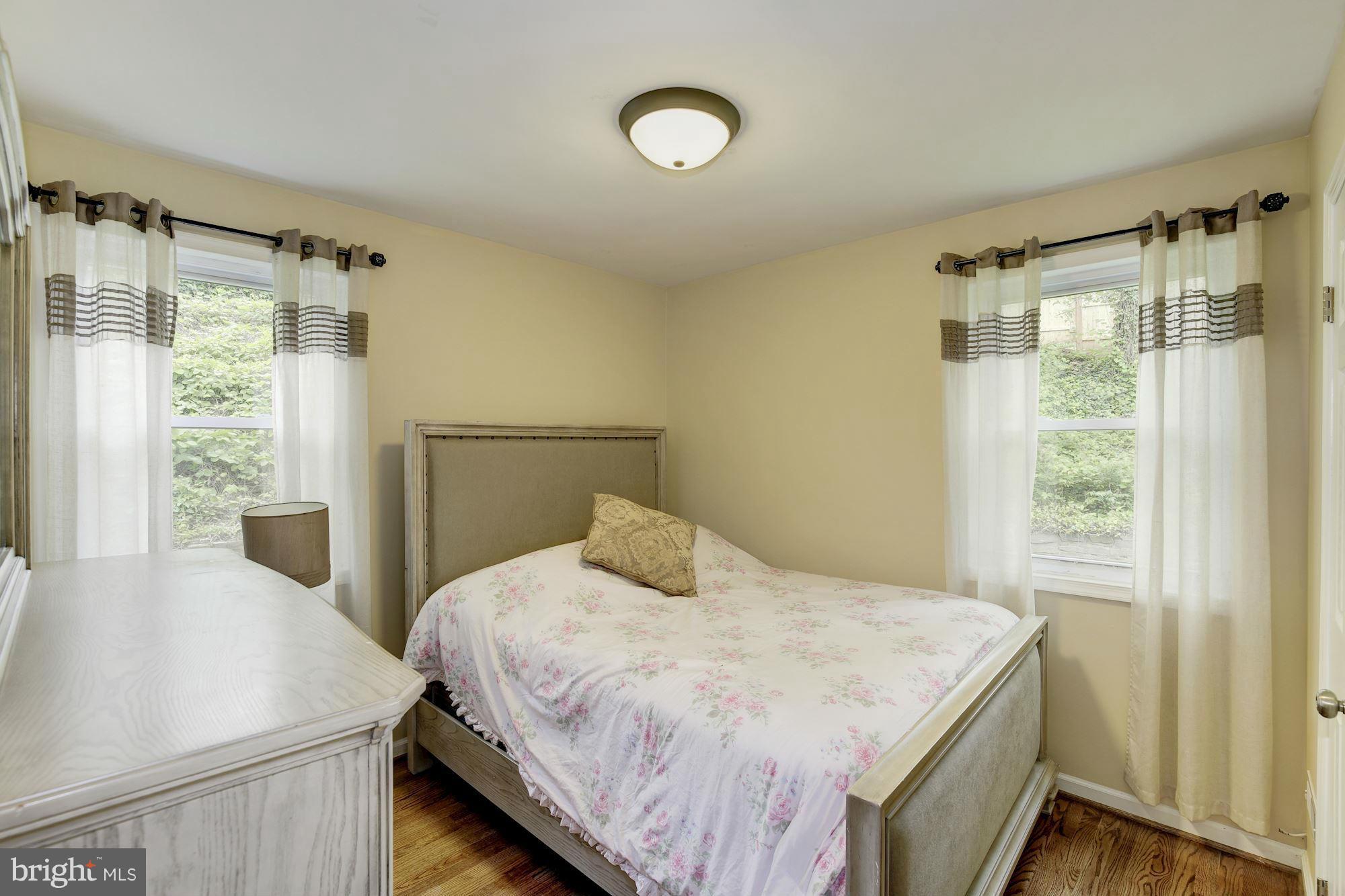 11601 Mapleview Drive Silver Spring, MD 20902 - Photo 14 of 23 a bedroom with a bed and a window