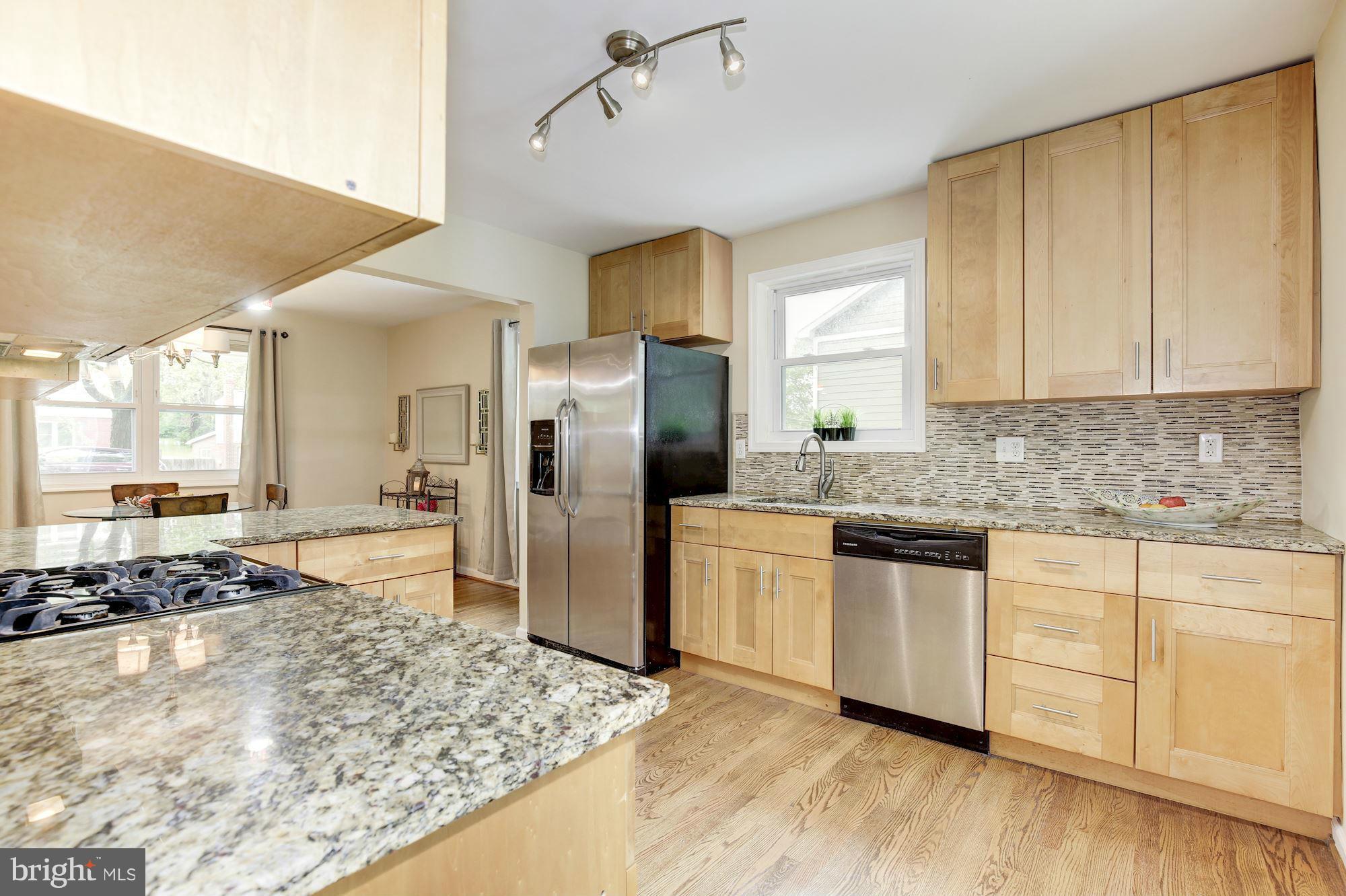 11601 Mapleview Drive Silver Spring, MD 20902 - Photo 5 of 23 a kitchen with refrigerator and window