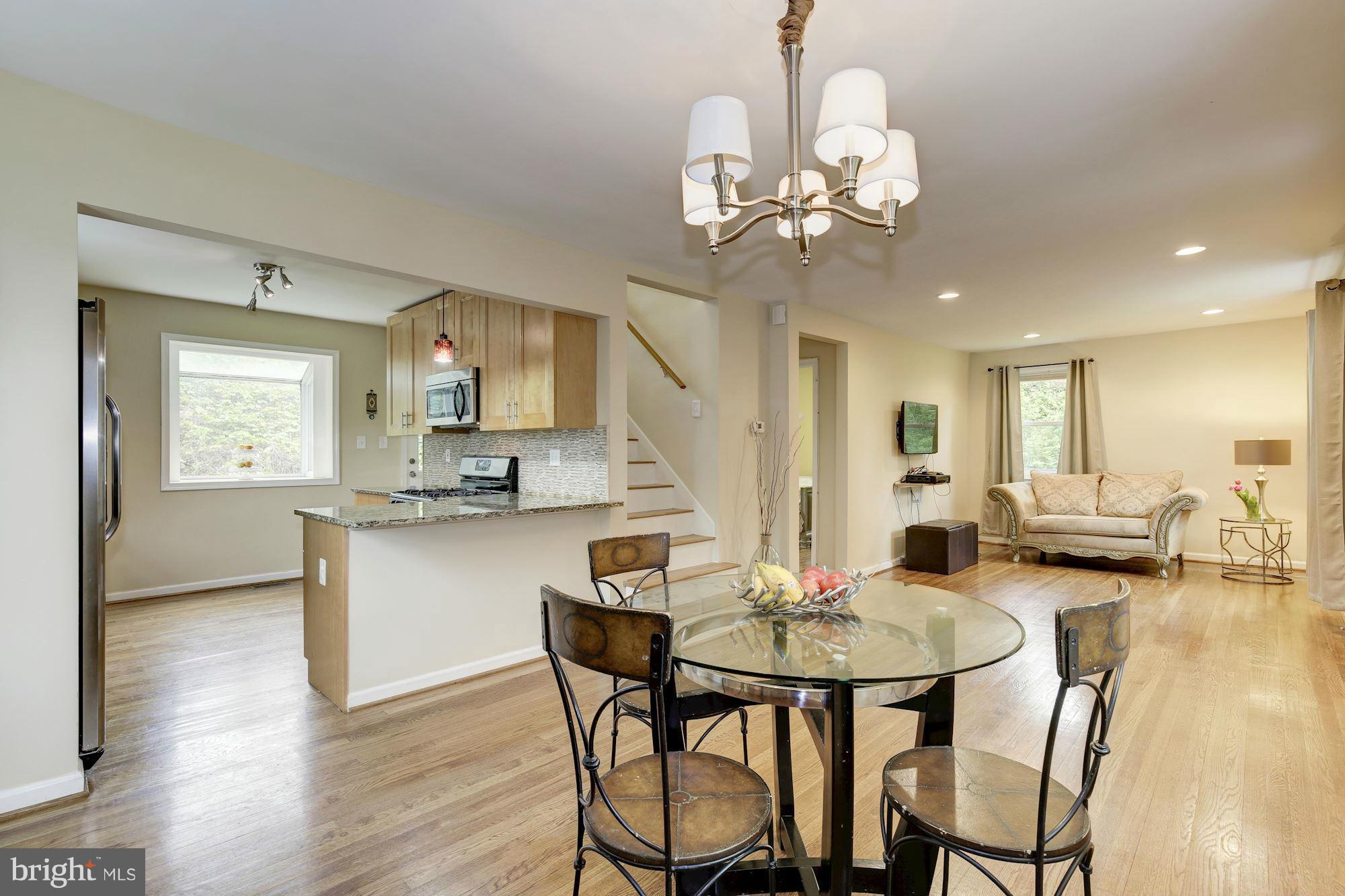 11601 Mapleview Drive Silver Spring, MD 20902 - Photo 6 of 23 a view of a dining room with furniture and wooden floor