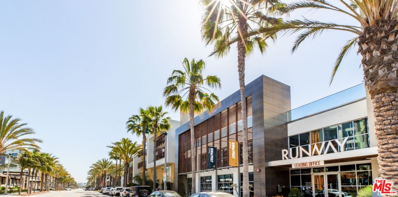 12760 Millennium Drive, Unit NA411 Los Angeles, CA 90094 - Photo 1 of 34 a view of a palm trees in front of a building