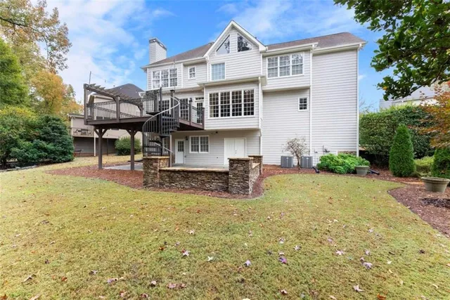 an aerial view of a house with a lake view