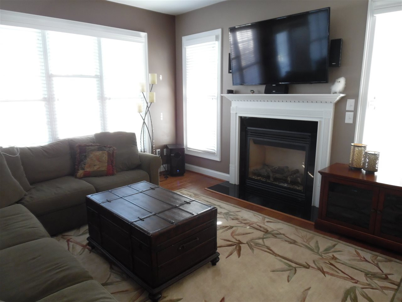110 Fort Jackson Road Morrisville, NC 27560 - Photo 3 of 25 Family room is open to the kitchen and features a gas fireplace and hardwood flooring Family Room