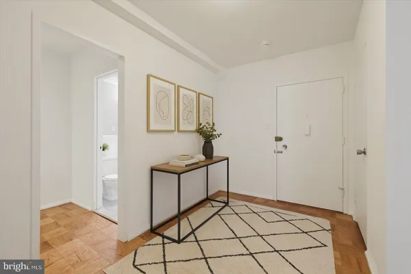 a view of a hallway to rooms