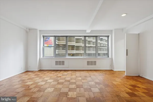 a view of an empty room with a window