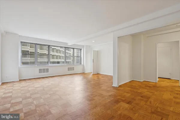a view of an empty room with a window