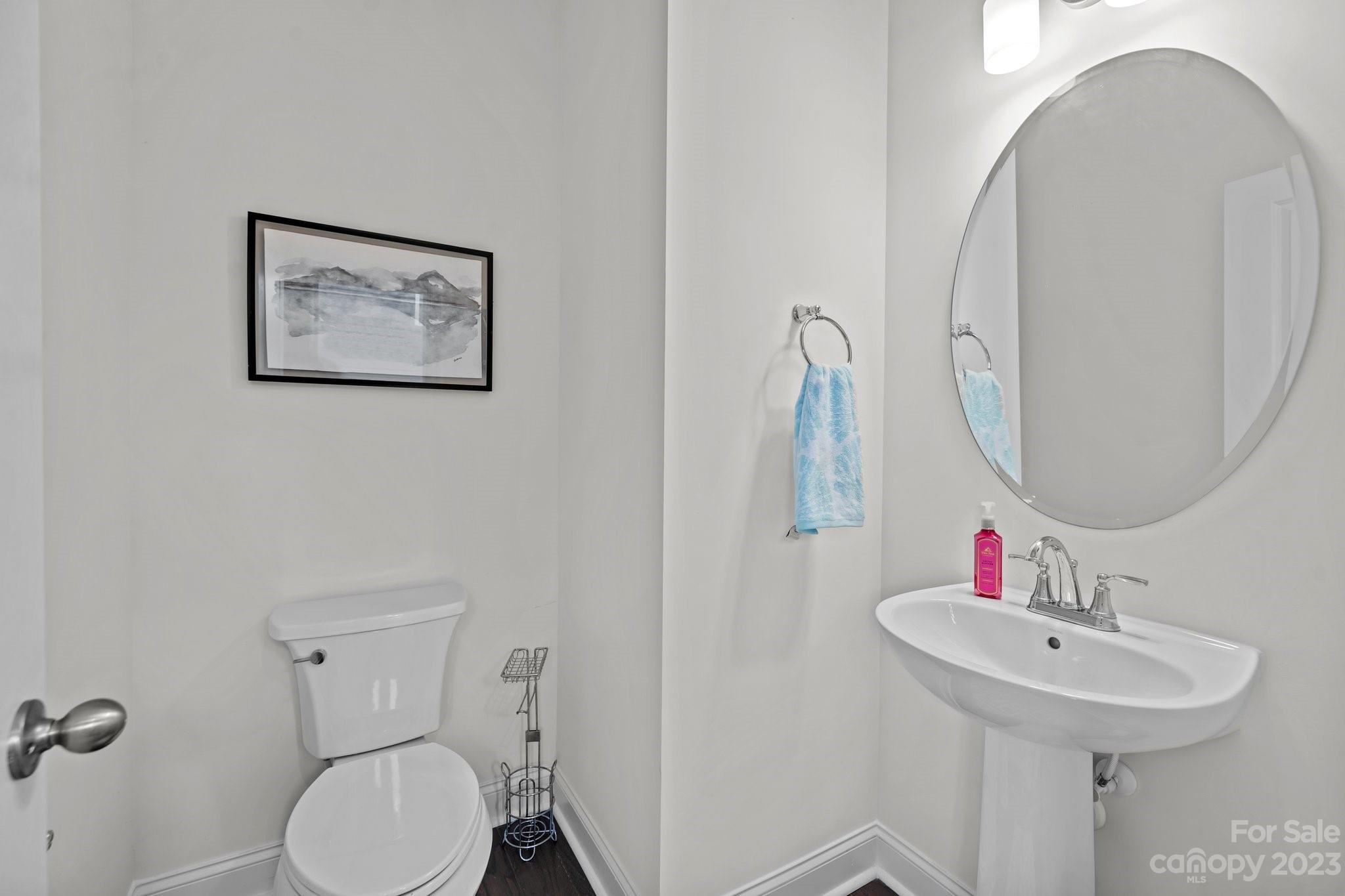 2075 Suttonview Road Fort Mill, SC 29708 - Photo 13 of 39 a bathroom with a toilet sink and mirror