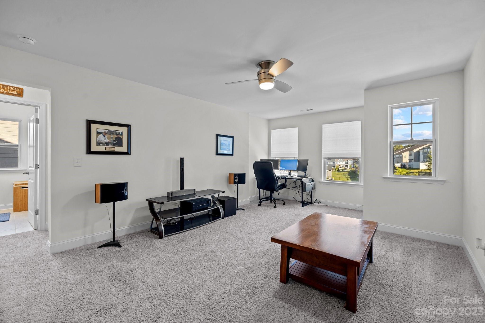 2075 Suttonview Road Fort Mill, SC 29708 - Photo 15 of 39 a living room with furniture and wooden floor
