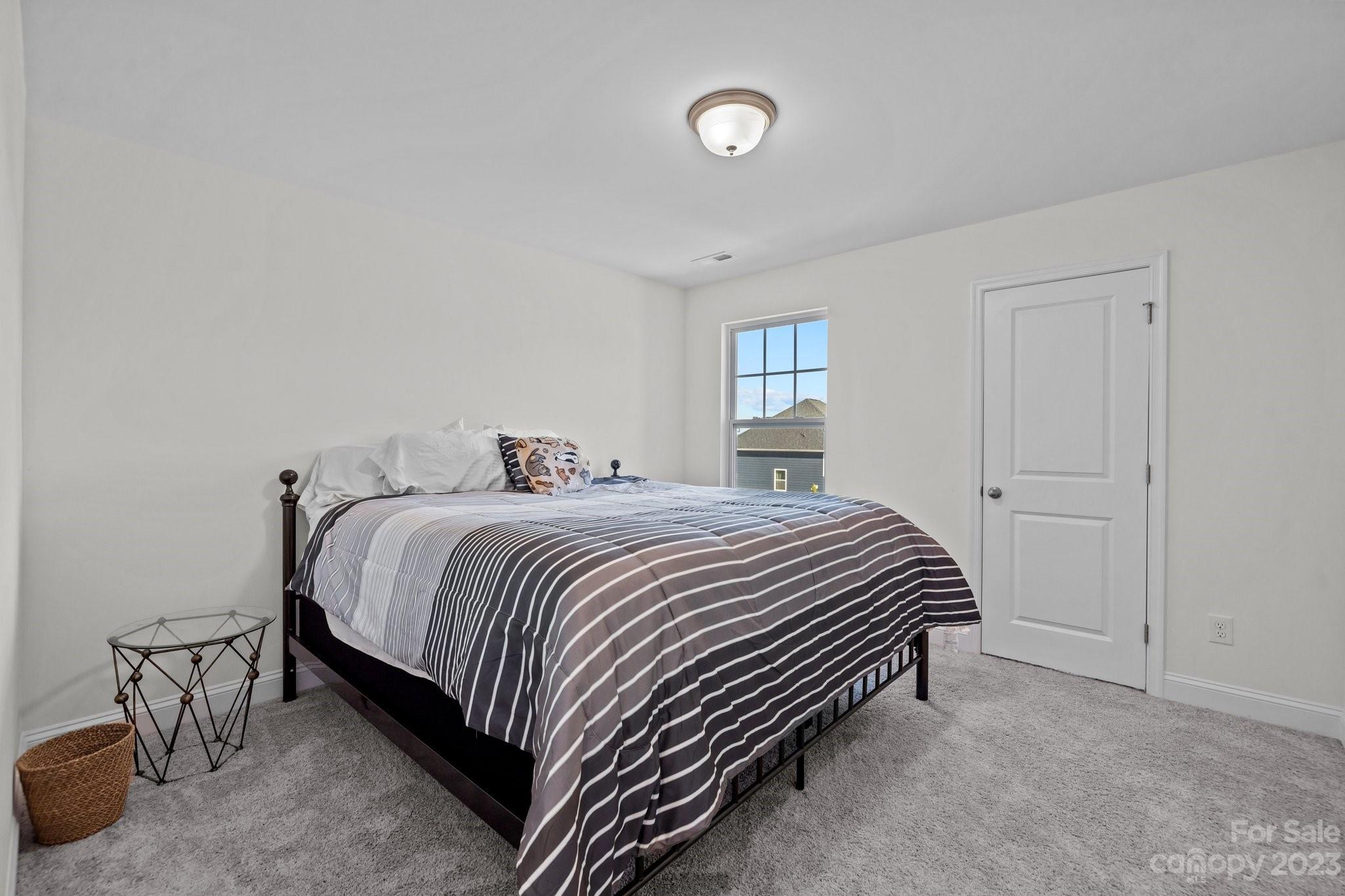 2075 Suttonview Road Fort Mill, SC 29708 - Photo 18 of 39 a bedroom with a bed and window