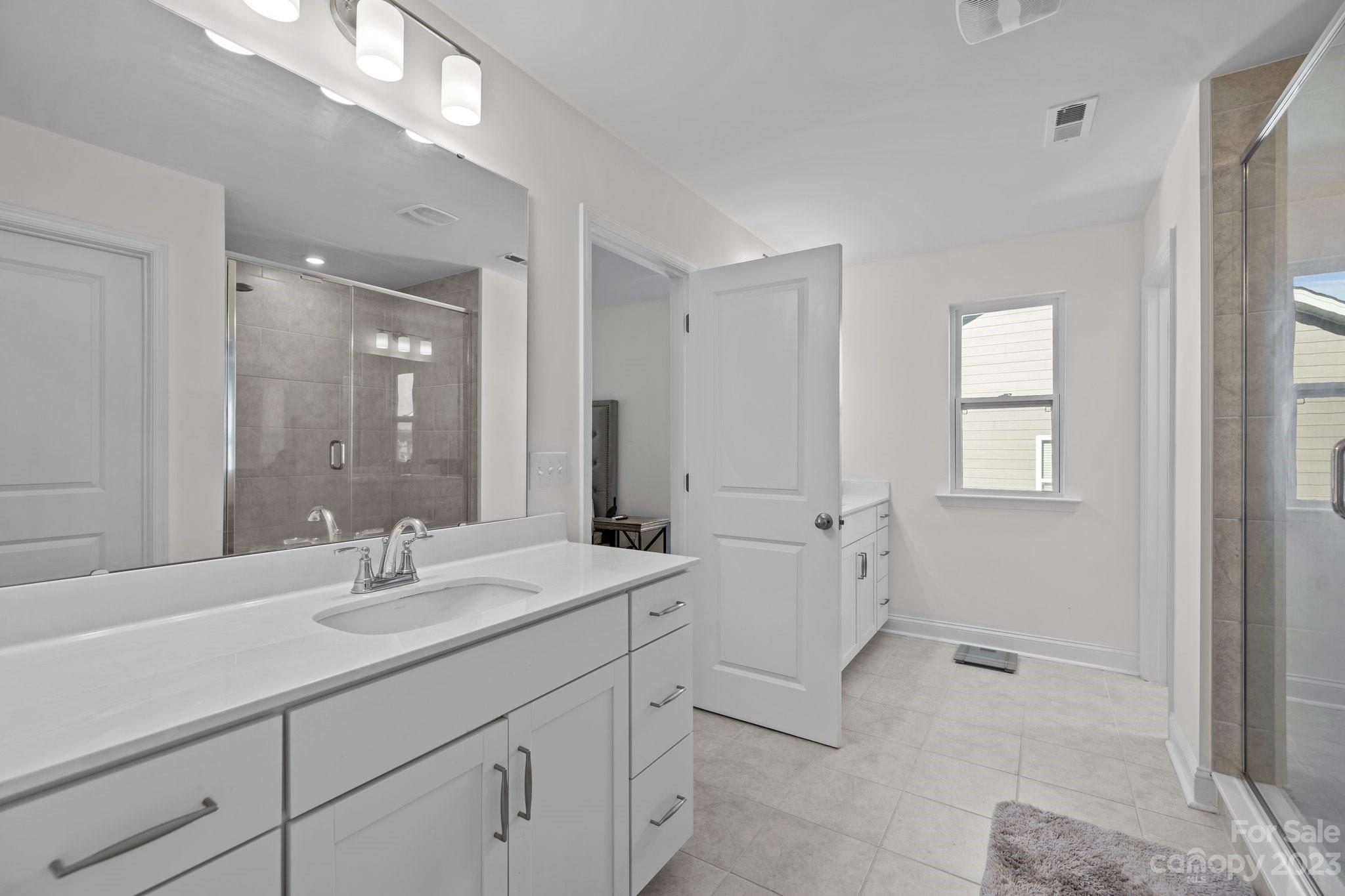 2075 Suttonview Road Fort Mill, SC 29708 - Photo 24 of 39 a bathroom with 2 sink tub and a mirror