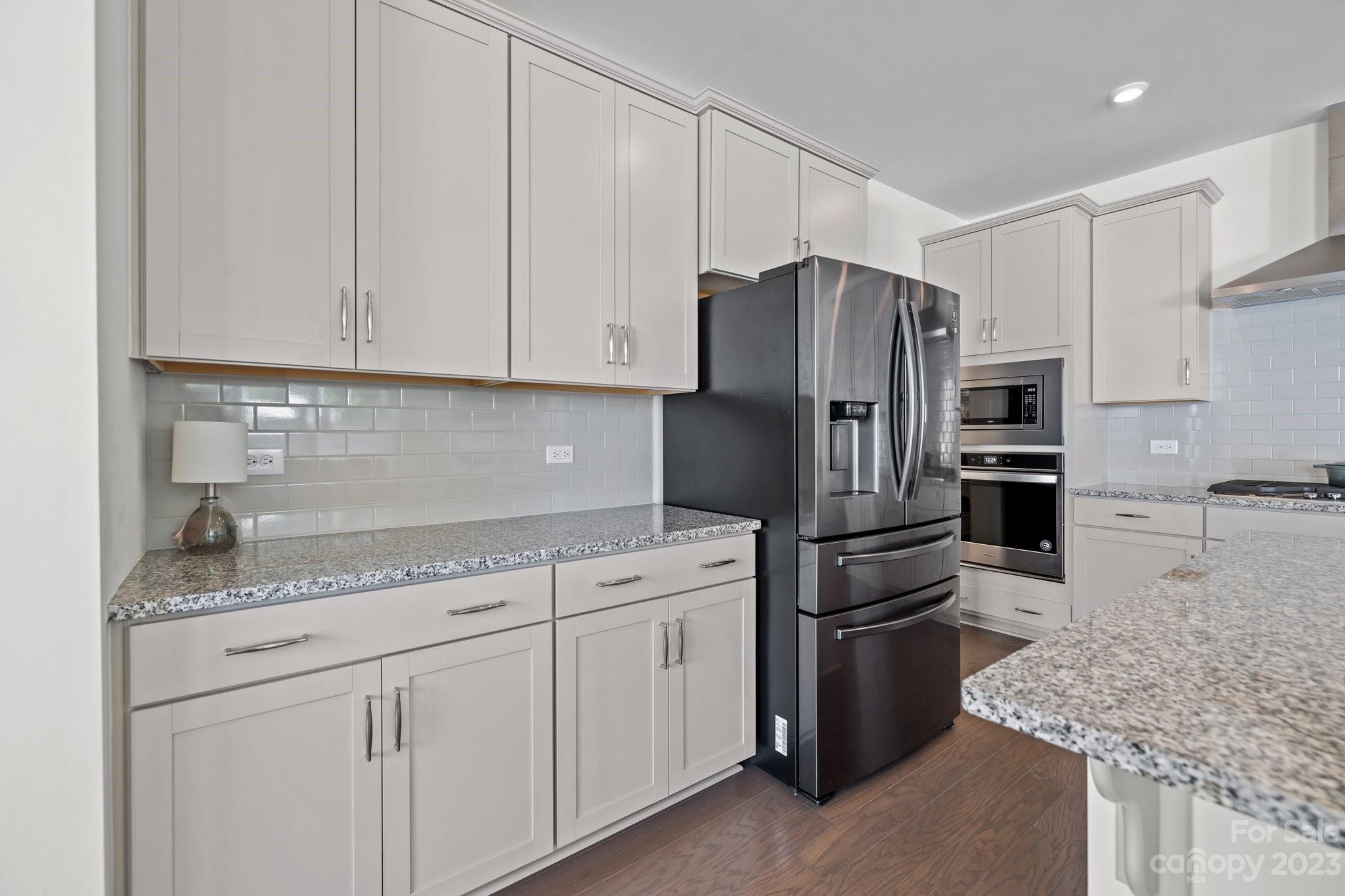 2075 Suttonview Road Fort Mill, SC 29708 - Photo 5 of 39 a kitchen with stainless steel appliances granite countertop a refrigerator sink and cabinets