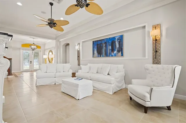 a bedroom with a bed and a ceiling fan