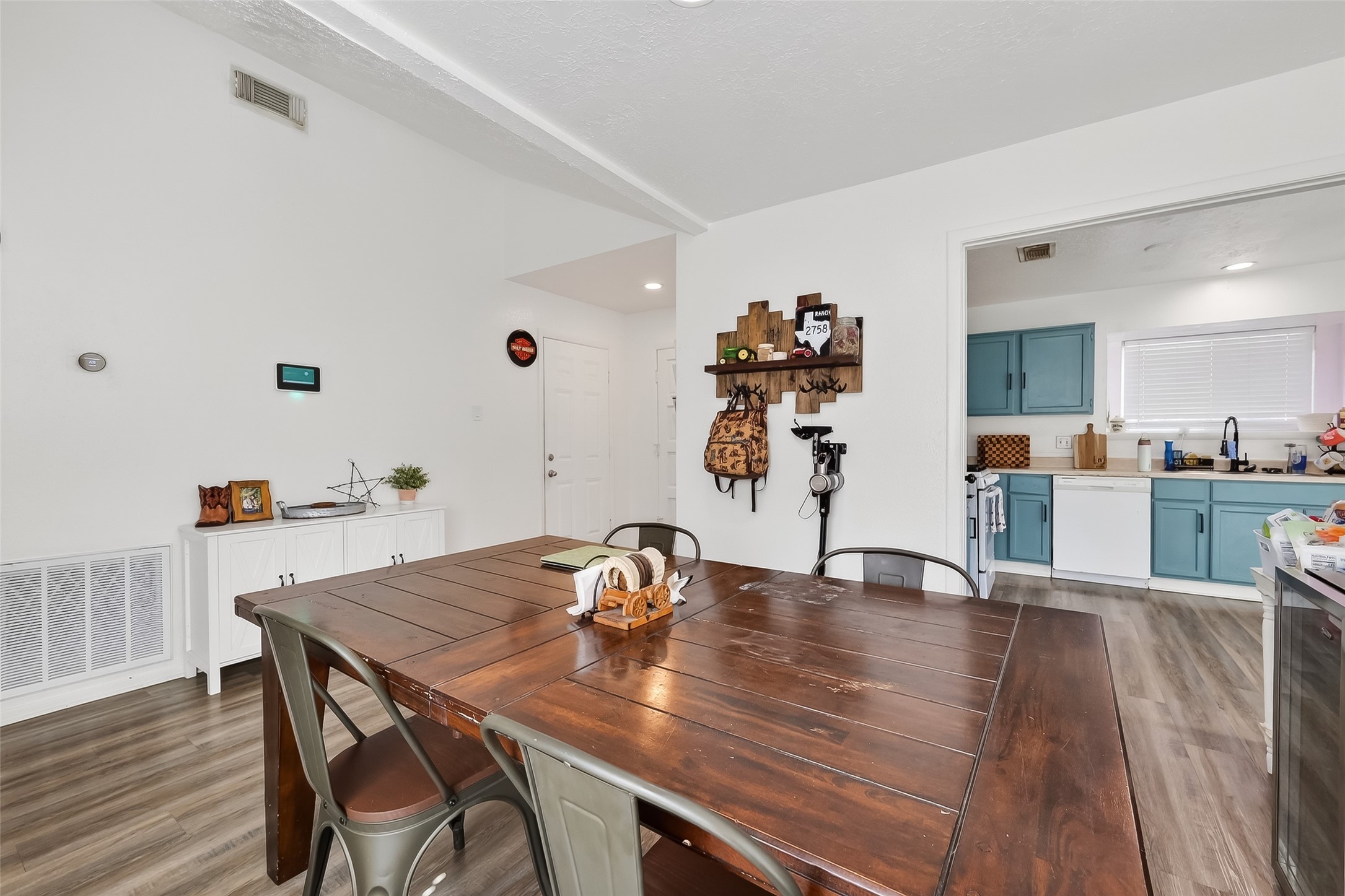 2526 Spring Dusk Drive Spring, TX 77373 - Photo 13 of 33 a view of a dining room with furniture and wooden floor