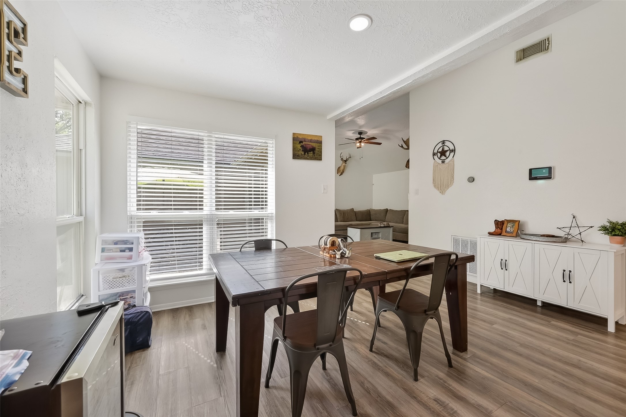 2526 Spring Dusk Drive Spring, TX 77373 - Photo 14 of 33 a view of a dining room with furniture and wooden floor
