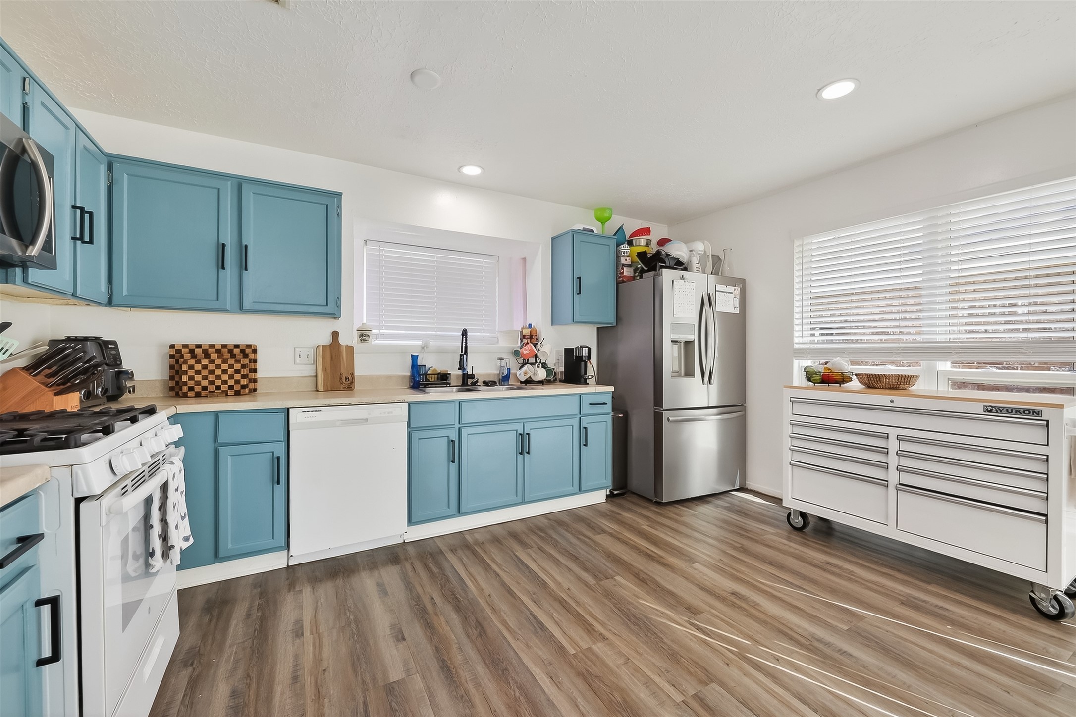 2526 Spring Dusk Drive Spring, TX 77373 - Photo 15 of 33 a kitchen with a refrigerator and cabinets