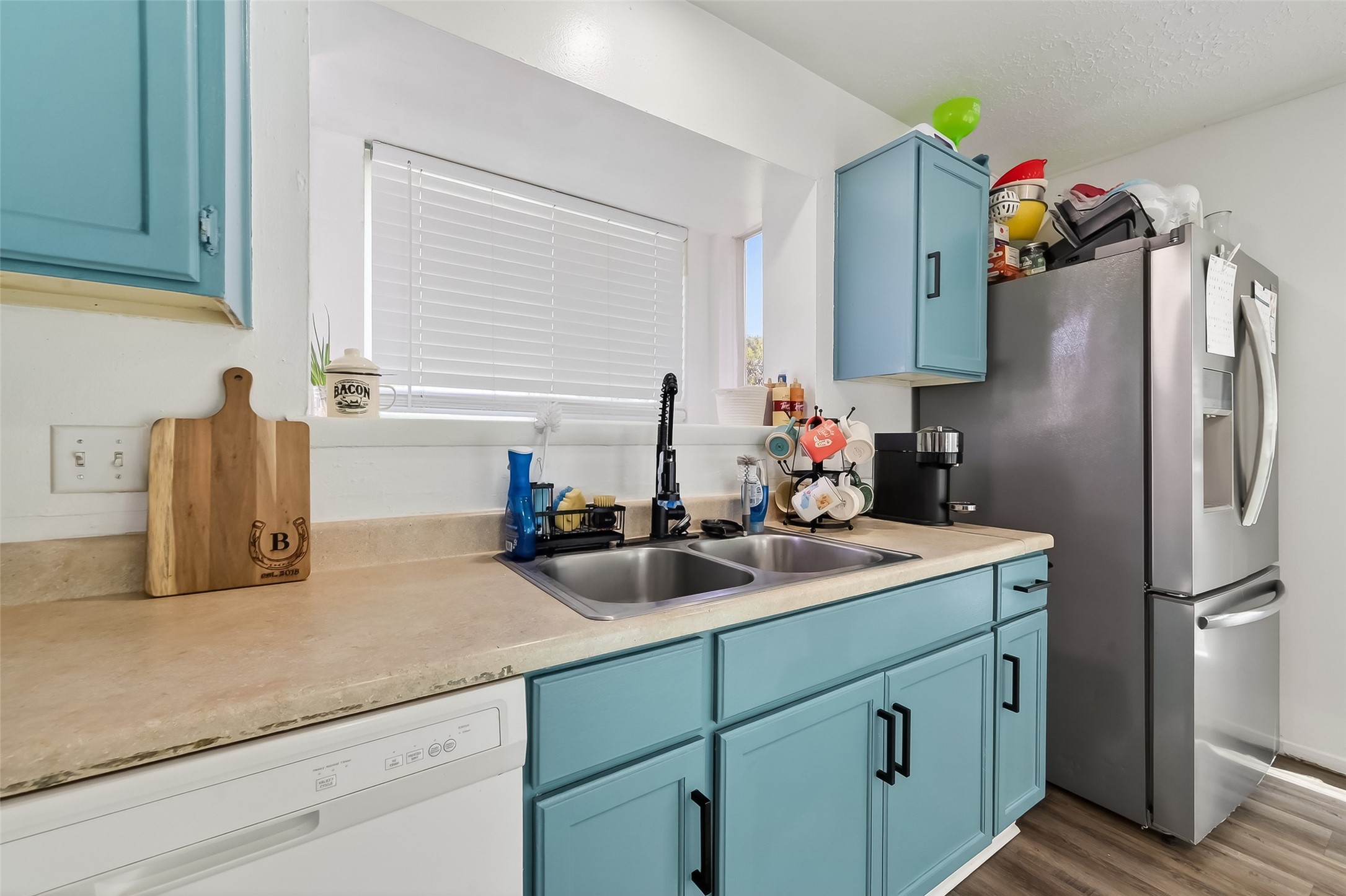 2526 Spring Dusk Drive Spring, TX 77373 - Photo 17 of 33 a kitchen with a sink refrigerator and microwave