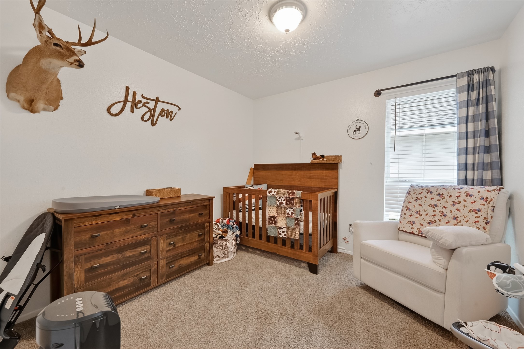 2526 Spring Dusk Drive Spring, TX 77373 - Photo 21 of 33 a bedroom with a bed and a couch