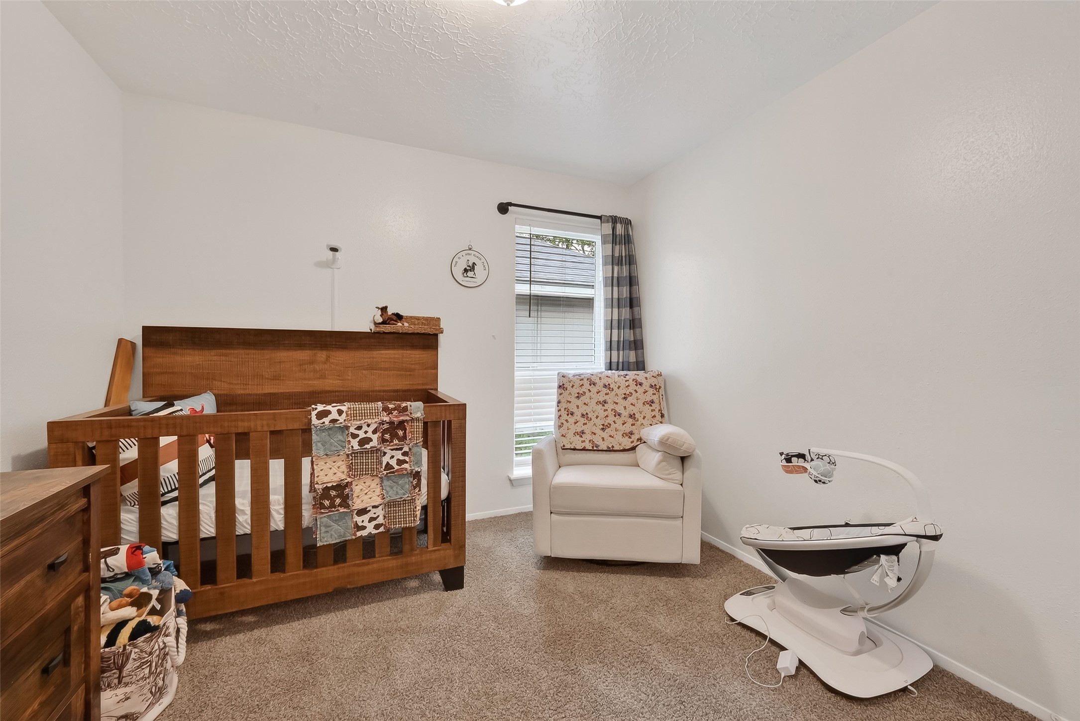 2526 Spring Dusk Drive Spring, TX 77373 - Photo 22 of 33 a bedroom with furniture and a baby crib