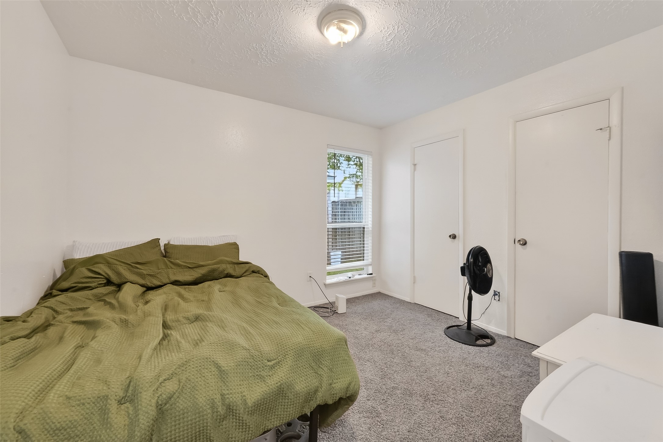 2526 Spring Dusk Drive Spring, TX 77373 - Photo 25 of 33 a bedroom with a bed and a chair