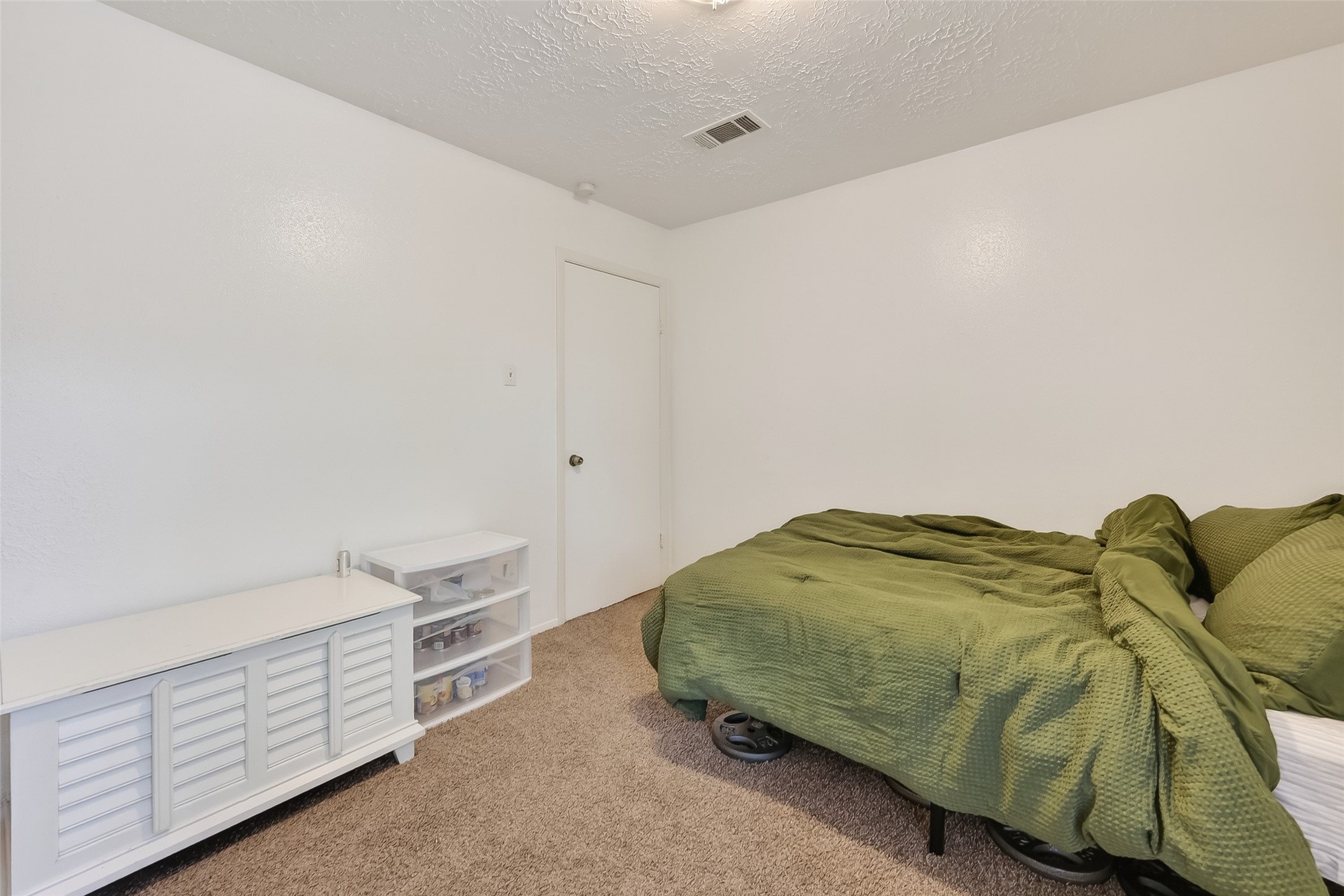2526 Spring Dusk Drive Spring, TX 77373 - Photo 26 of 33 a bedroom with a bed and a cabinets