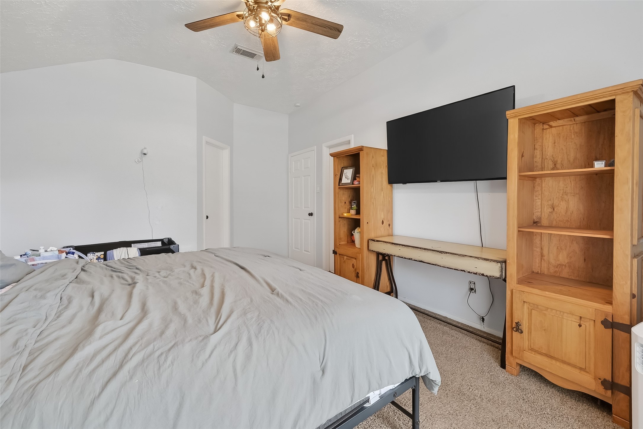 2526 Spring Dusk Drive Spring, TX 77373 - Photo 28 of 33 a bedroom with a bed and a flat screen tv